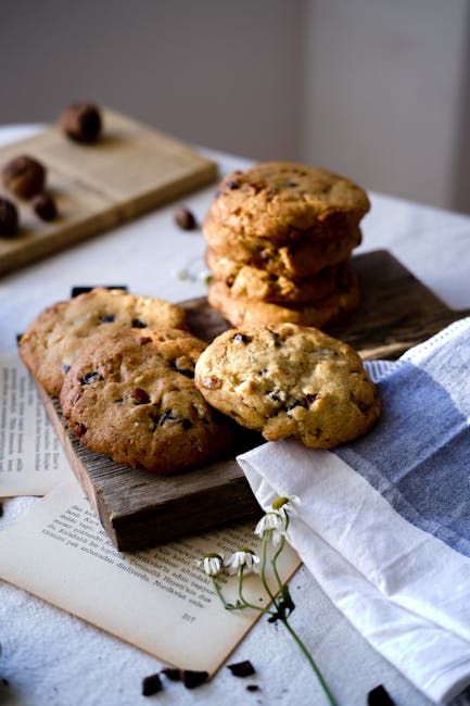 Rustic arrangement of homemade chocolate chip cookies on wooden boards.